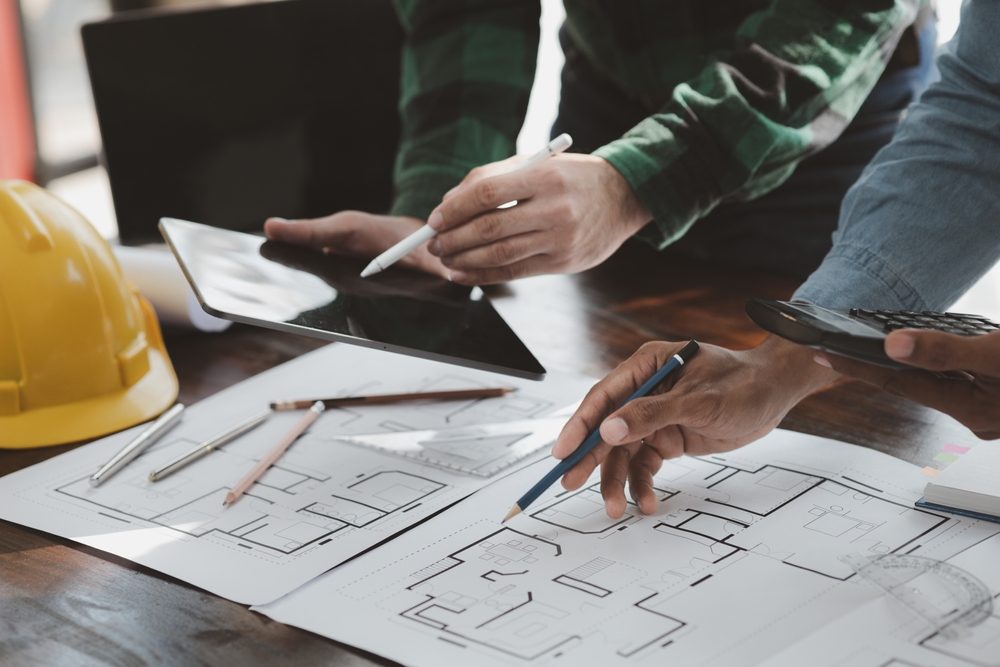 The,Home,Design,Architects,Are,Reviewing,The,House,Plan,Draft,