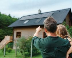 Rear,View,Of,Dad,Holding,Her,Little,Girl,In,Arms